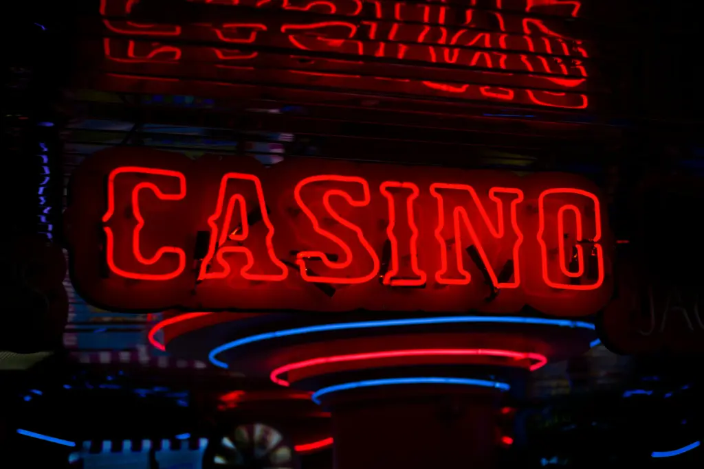A red and blue neon casino sign.